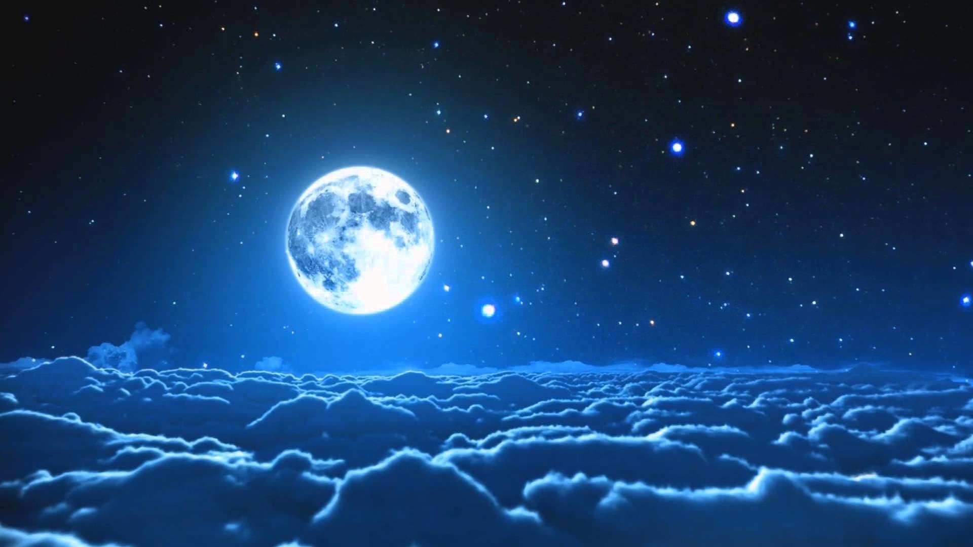 Moon above the clouds against a stary night sky