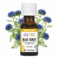 Aura Cacia Blue Tansy in Jojoba with Blue Tansy flowers behind bottle