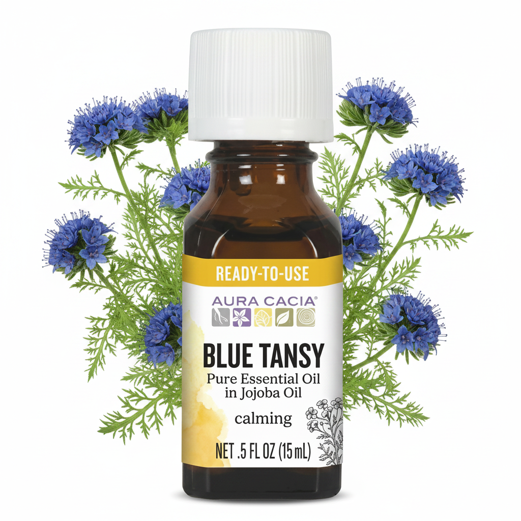 Aura Cacia Blue Tansy in Jojoba with Blue Tansy flowers behind bottle