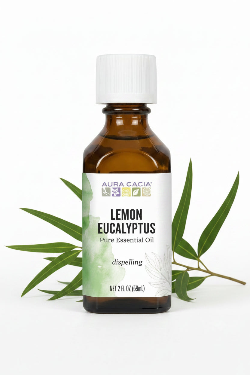 A 2 fl oz amber glass bottle of Aura Cacia Lemon Eucalyptus pure essential oil with a white cap and white label, set against a plain white background.