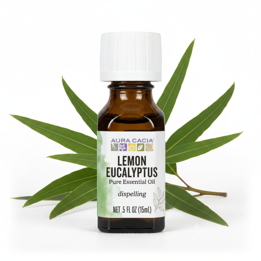 A 5 fl oz amber glass bottle of Aura Cacia Lemon Eucalyptus Pure Essential Oil with a white cap and a white label featuring green watercolor accents.