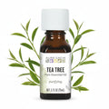 Aura Cacia Tea Tree essential bottle on white background