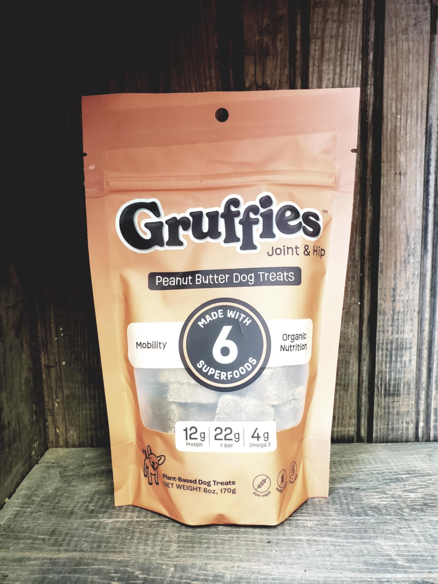Gruffies Joint & Hip Peanut Butter Dog Treats package on a wooden surface