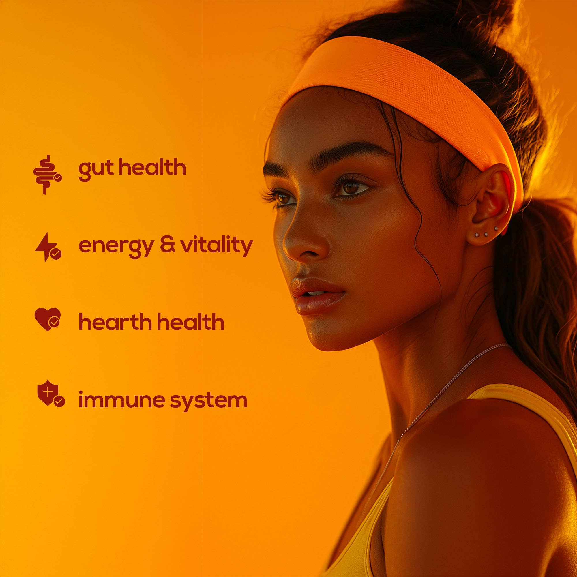 Woman wearing an orange headband with health benefits listed on an orange background