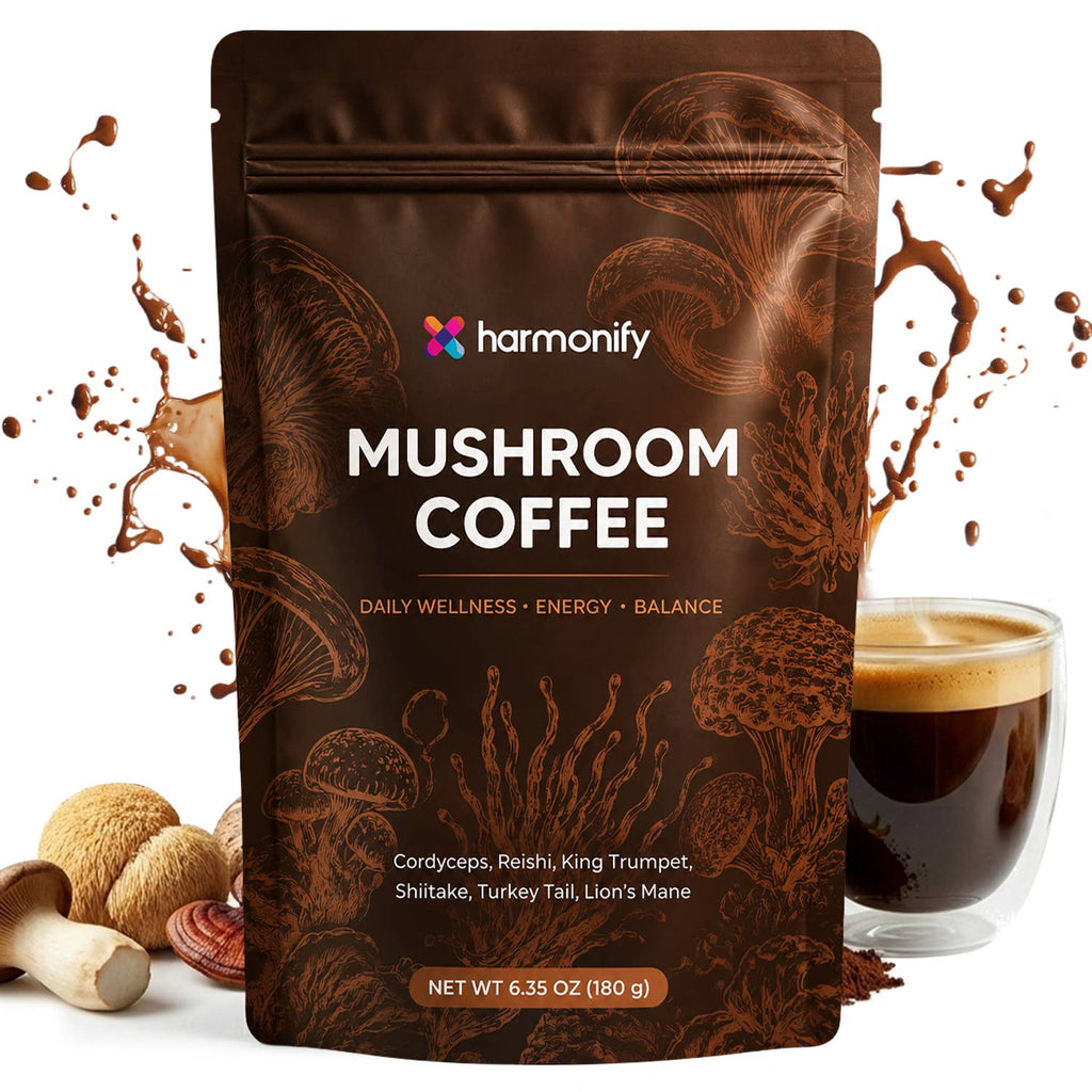 A stand-up pouch of harmonify Mushroom Coffee with brown mushroom illustrations, shown on a white background with a glass of dark coffee, loose mushrooms, and coffee splashes.