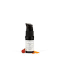 A bottle of Vitamin C Serum with a dropper, surrounded by dried flowers. The label indicates the product contains CBD and is for skin and hair use.