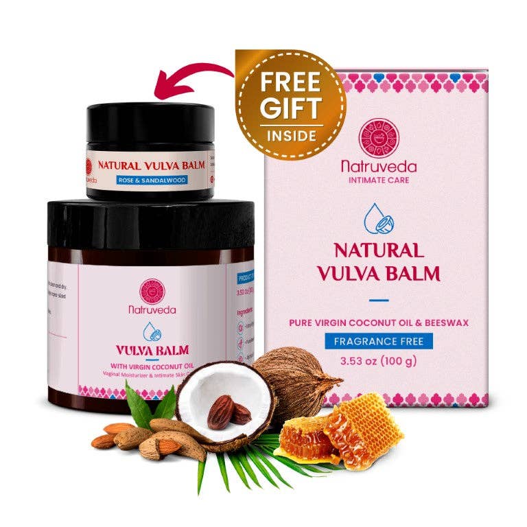 Natuveda Natural Vula Balm shown with two jars, a retail box, a gold 'Free Gift Inside' badge, and ingredient props including a coconut, almonds, honeycomb, and green leaves on a white background.