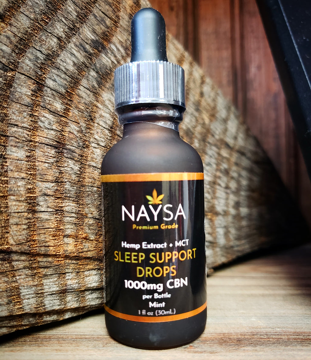 Naysa Sleep Support Drops on a rustic background