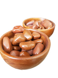 Wooden bowls filled with red jasper stones on a white background