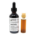 Bottle of Roots Apothecary Anxiety Tincture with dropper and small sample vial on a white background