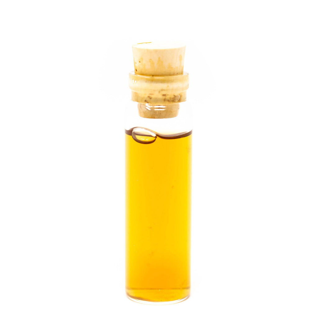 Bottle of yellow liquid with a cork on a white background