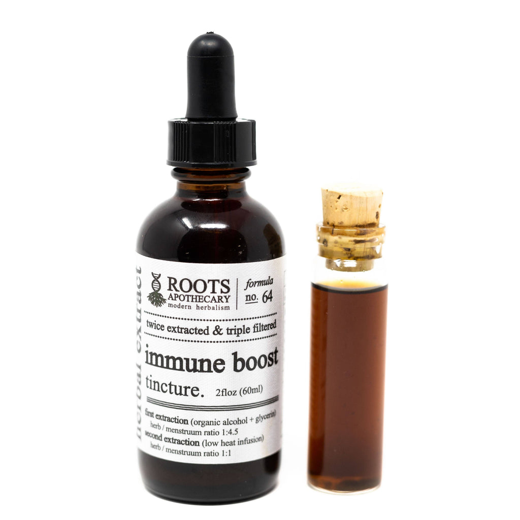 Bottle of immune boost tincture from Roots Apothecary on a white background
