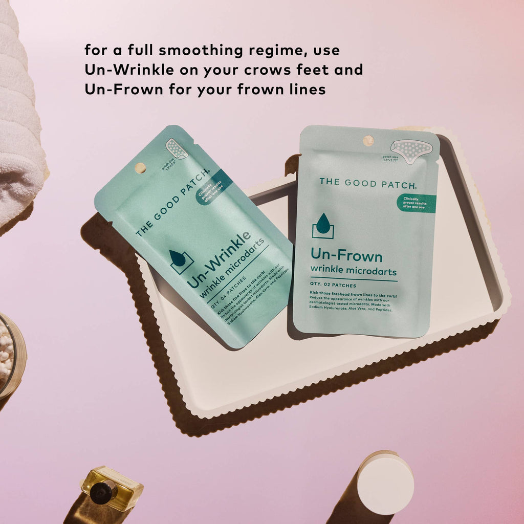 Two packages of 'The Good Patch' Un-Wrinkle and Un-Frown on a pink background with text.