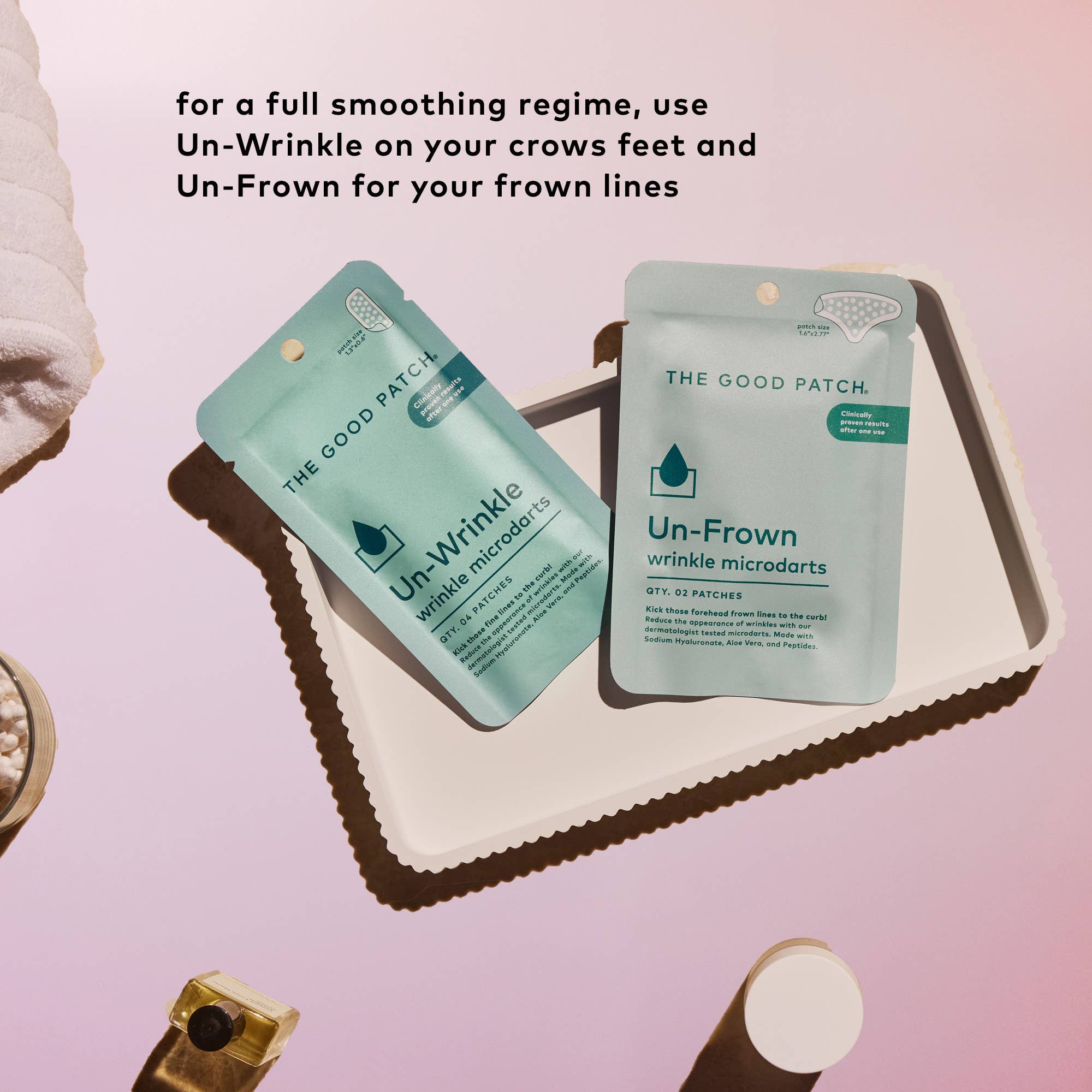 Two packages of 'The Good Patch' Un-Wrinkle and Un-Frown on a pink background with text.