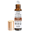 Roll-on bottle of 'Time Tamer' by Untamed Organics with gold cap and white label on a white background